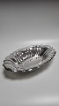 Table top made 
of hammered 
silver 
830sH.5,5cm 
L.34,5cm. 
W.23.5cm.Five 
in good used 
condition.