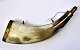 Large 
powderhorn off 
horn with brass 
mounting, 19th 
century. 
Denmark. 
Length: 26 cm.