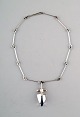 Björn Weckström, Lapponia, Finland.
Vintage modernist necklace in sterling silver with blue stone in pendant, 
handmade.