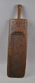 Danish board, 
1712, beech 
With cuts and 
year. Length: 
62 cm.