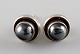 A pair of ear studs in sterling silver by Georg Jensen with cabochon cut 
hematite.