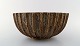 Arne Bang. Large bowl with fluted corpus decorated with brown speckled glaze.
