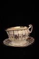 Sauce jug on 
dish in 
"Henriette" by 
Royal 
Copenhagen.
Year 1850-70. 
Dimensions: H: 
12cm. ...
