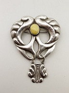 Arts and craft sterling silver brooch with amber