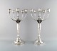 A pair of impressive five armed Georg Jensen candelabra in sterling silver 
design 474. Each in a mahogany case from Georg Jensen.
