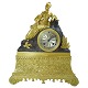 A French clock 
of gilt bronze, 

neo-rococo.
Watch  in 
brown patinated 
bronze with a 
lying ...