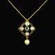 14k Gold 
Pendant with 
Oriental Pearls 
and Emerald.
Stamped with 
DH 585.
Pendant 3 x 
1,8 cm. / ...