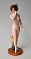 German 
porcelain 
figure, approx. 
1900 -1910. 
Nude woman. 
Cold-painted 
bisquit figure 
with glued ...