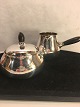 Georg Jensen.
  Designed by 
Georg Jensen
   Sugar and 
cream jug of 
lightly 
hammered 
sterling ...