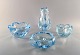 Vicke Lindstrand for Orrefors. Set of 4 "Stella Polaris" bowls / vases in light 
blue mouth blown art glass. Mid-1900