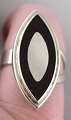 Scandinavian modernist ring in sterling silver and exotic wood.
