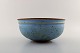 Helle Allpass (1932-2000). Large bowl of glazed stoneware in beautiful light 
blue glaze with iron spots. 1960 / 70