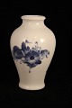 Vase in Blue 
Flower, Braided 
from Royal 
Copenhagen.
Decoration 
number: 
10/8259. 
1.Quality.
H: ...