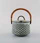 Bing & Grondahl. Sugar bowl with handle in wicker work.
B & G Grey Cordial Quistgaard Nissen Kronjyden stoneware.