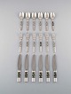 Georg Jensen. Cutlery, Scroll No. 22, Complete lunch service of hammered 
sterling silver.