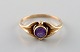 Hermann Siersbøl, Danish goldsmith. Art deco ring in 14 carat gold adorned with 
purple stone. 1940