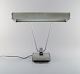 Eileen Gray 
1878-1976. Art 
deco chromed 
iron desk lamp, 
gray lacquered. 
Adjustable arm 
and ...