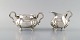 Sugar bowl and creamer in silver on feet. Rococo style, 1920s / 30