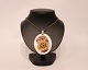 Necklace of 
silver with 
large porcelain 
pendant by 
Royal 
Copenhagen.
55 cm and 6 cm 
x 5 cm.