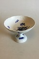 Royal 
Copenhagen Blue 
Flower Curved 
Footed Cake 
Tray No 1528. 
Measures 15.5 
cm / 6 7/64 in. 
x 21 ...