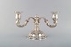 Two-armed neo rococo candlestick with curved arms in silver (830). 1930 / 40