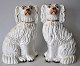 Pair of 
Straffordshire 
poodle dogs, 
19th century 
England. King 
Charles 
Spaniels. H: 
16.5 cm. The 
...