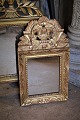 Decorative, French 1800's mirror with fine decorated frame with old gilding with a super fine ...