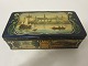 An old chocolate box/can from the Elvirasminde, 
Aarhus, Denmark 
Text: Slots Chokolade (Castle chocolate)
The box/can has very beautiful pictures as 
decoration 
L: 17cm
W: 8,5cm
H: 5cm
In a good condition but old