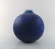 Early Saxbo, large spherical shaped ceramic vase in modern design.
Exceptionally beautiful glaze in many shades of blue. Ca. 1930.