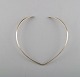 N.E. From 
sterling silver 
neck ring. 
Danish design 
1970's.
Neck ring 
interior 13.5 
to 14.5 cm. ...
