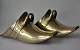 A pair of 
Argentine 
"riding shoes" 
in brass, 19th 
century. Length 
25 cm.