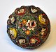 Mille fiori 
brosche, Italy, 
o. 1900. Micro 
mosaic with 
flowers. With 
brass mounting. 
Dia: 3.6 cm.