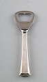 Evald Nielsen 
number 32, 
bottle opener 
in sterling 
silver. 
Measures 12 
cm.
Stamped.
In ...