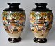 Pair of 
hand-painted 
Satsuma vases, 
20th century 
Japan. 
Polycrome 
decoration with 
woman in front 
...