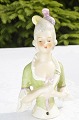 Porcelain 
figurine. Half 
pin cushioon 
doll, Height 
10.5 cm. 4 1/8 
inches. Fine 
condition.