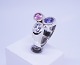 Large ring of 
925 sterling 
silver with 
three synthetic 
stones in 
different light 
purple colours, 
...