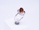Ring of 925 
sterling 
silver, 
decorated with 
amber and 
twisted silver, 
stamped EF.
Size - 56.