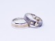 A pair of 
wedding rings 
of 925 sterling 
silver and 14 
ct. gold, 
stamped Br.J. 
by ...
