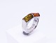 Ring of 925 
sterling silver 
decorated with 
amber.
Size - 57.
