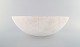 Ingegerd Råman 
for Orrefors, 
Sweden. Large 
"Savann" bowl 
in milky white 
art glass. Late 
...