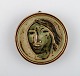 Jais Nielsen for Royal Copenhagen. Ceramic plaque with face in beautiful sung 
glaze. 1930