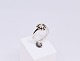 Ring of 14 ct. 
white gold 
decorated with 
13 diamonds. 
One triangel 
shaped diamond 
of 0,72 carats 
...