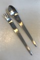 Arne Jacobsen 
for Anton 
Michelsen 
Stainless Salad 
Set Measures 
28.5 cm (11.22 
in)