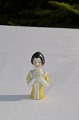 Porcelain 
figurine. Half 
pin cushioon 
doll, Height 
3.6 cm.  10 
Feet. Fine 
condition.