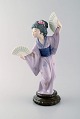 Lladro, Spain. Large figure in glazed porcelain. Geisha with fans. 20th century.