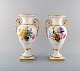 A pair of Meissen empire vases with hand painted flower decoration. Ca.1900. 1st 
factory quality.