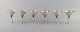 Harald Nielsen 
for Georg 
Jensen. A set 
of six cocktail 
glasses and six 
cocktail picks 
in ...