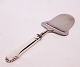 Cheese cutter 
in 
Christiansborg, 
hallmarked 
silver. Ask for 
number in 
stock.
21 cm.