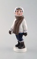 Dahl Jensen porcelain figurine. Boy in winter clothes. Model number 1064. 2nd 
factory quality. 1920/30