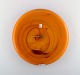 Kastrup / Holmegaard. Large wall clock in orange art glass from Holmegaard